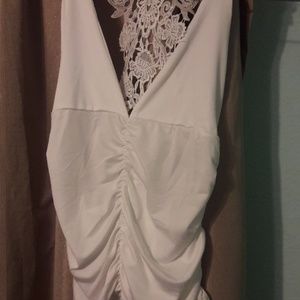 White sleveless blouse with embroidery in the back